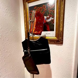 Trio of three HOBO wallet/wristlet purses in rich orange, black and brown.